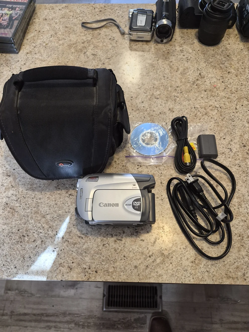 Canon Model # DC-320 Silver DVD Camcorder with Accessories